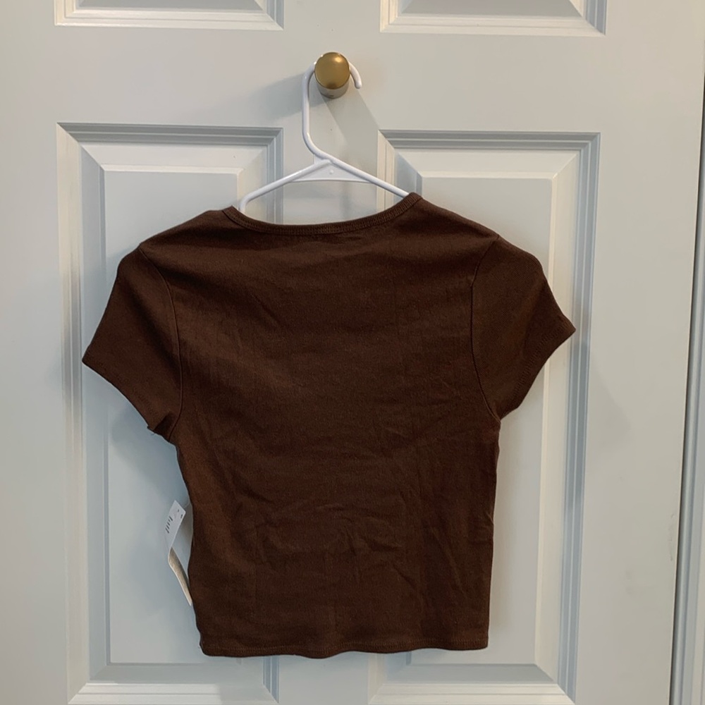 Brown Urban Outfitters baby tee with flower design